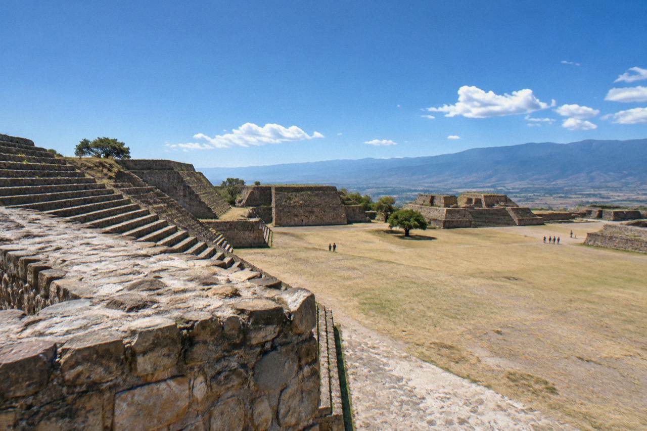 The stone platforms and plazas of Monte Albán under a wide sky above the Oaxaca valley