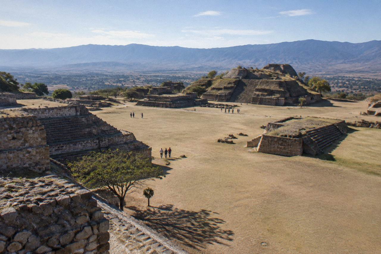 Wide stone terraces of the Monte Albán archaeological site under a morning sky in the Oaxaca valleys
