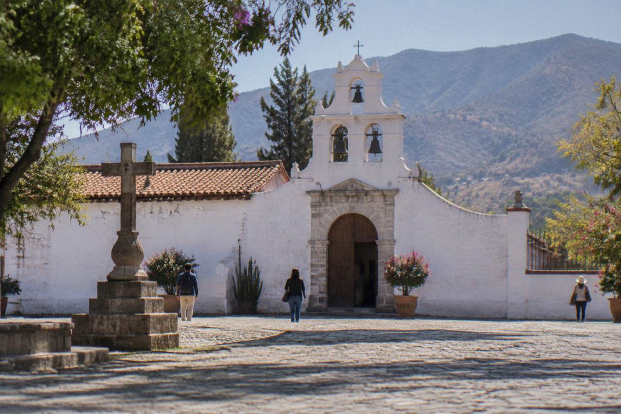 The whitewashed courtyard and bell gable of the small church in Jalatlaco, Oaxaca City