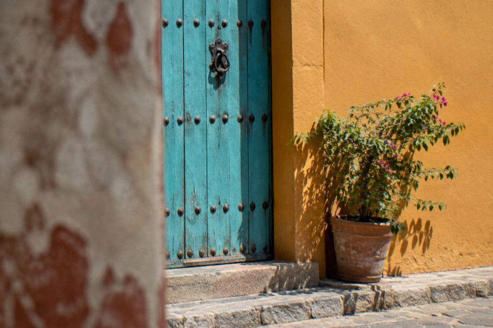A colorful painted doorway on a quiet street in Jalatlaco, Oaxaca City