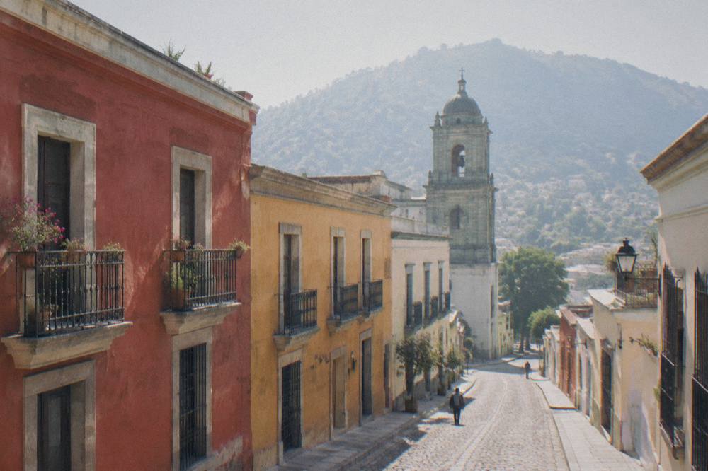 A quiet street corner in a residential part of Oaxaca City in morning light