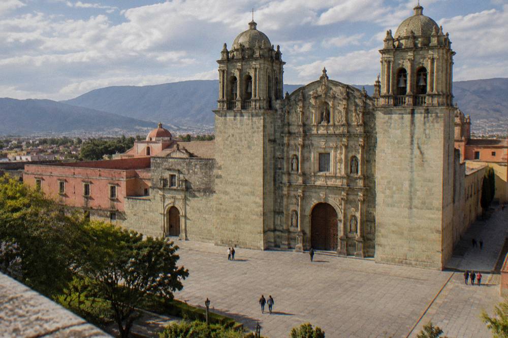 The facade of Santo Domingo de Guzmán church lit by afternoon sun in Oaxaca City