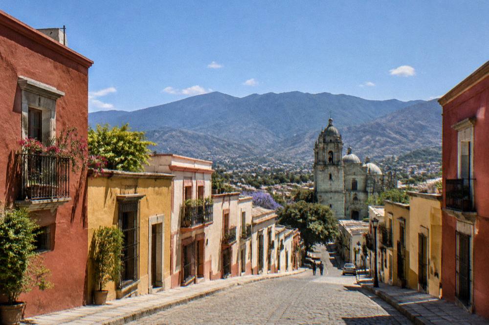 A view over the rooftops of Oaxaca City towards the hills that surround the valley