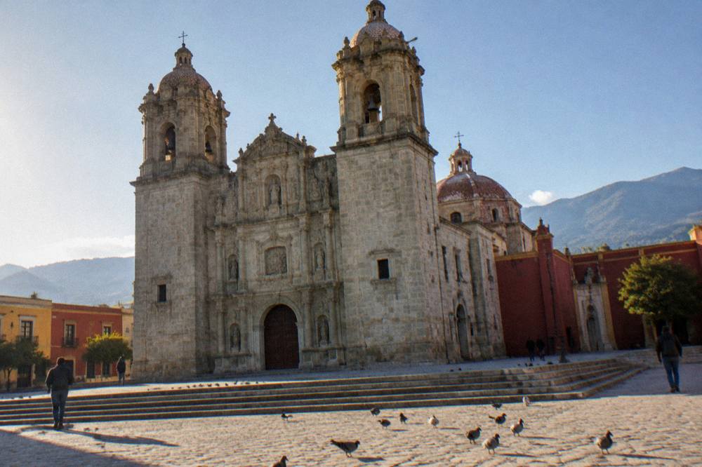 The towers and dome of the Basílica de la Soledad in Oaxaca City against an early morning sky