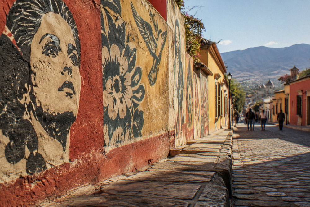A sunny morning on a painted street with clear skies over the rooftops