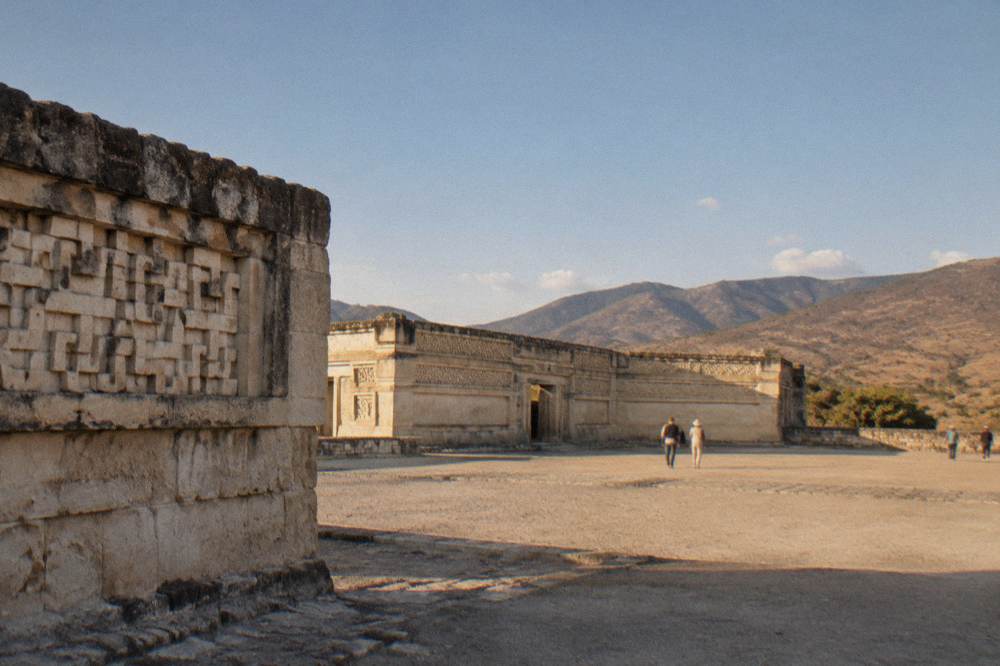 Fragments of carved geometric stone fretwork set into an old wall