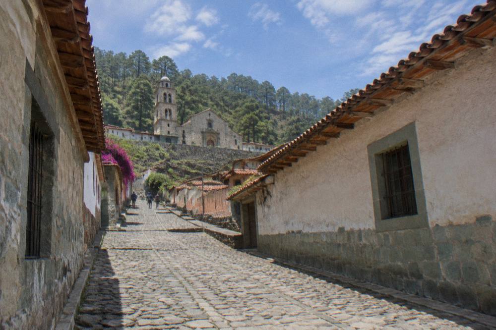 Oaxaca City street with green cantera stonework in the historic centre