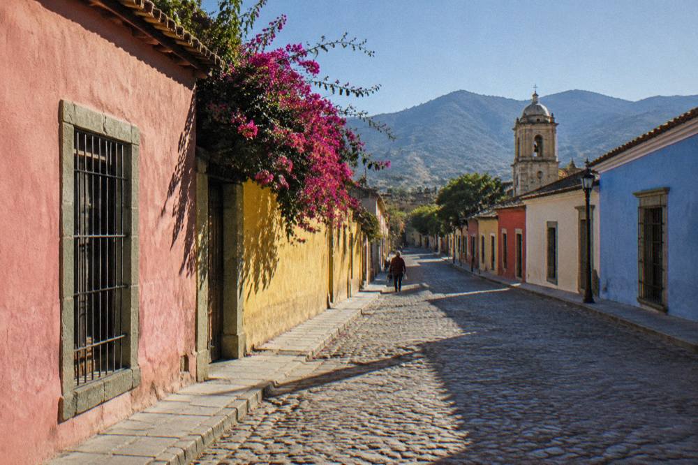 A village street with painted facades in a valley town near Santiago Matatlán
