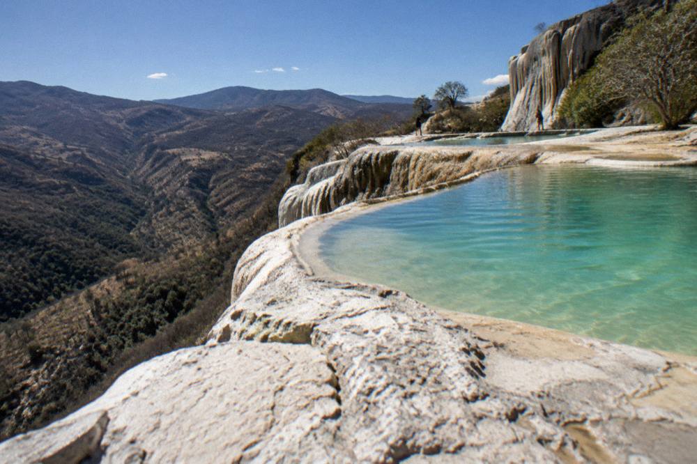 Terraced rock formations and pools at Hierve el Agua above the valley