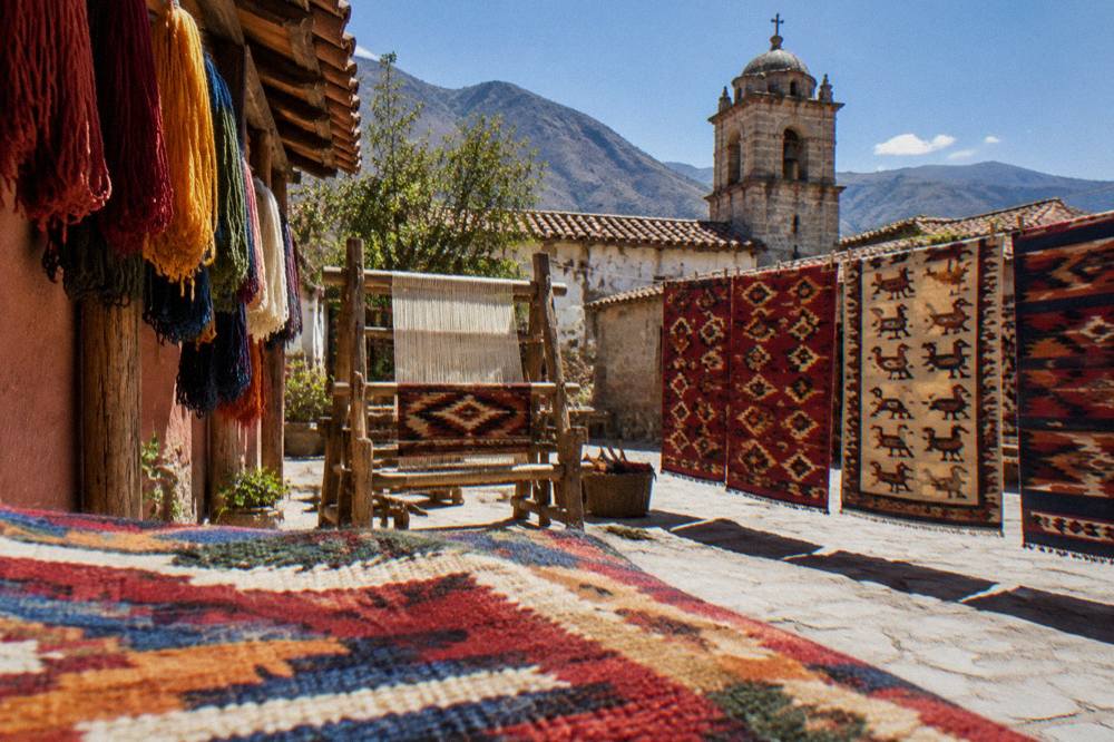 Colourful woven rugs displayed in a workshop in a Oaxacan village