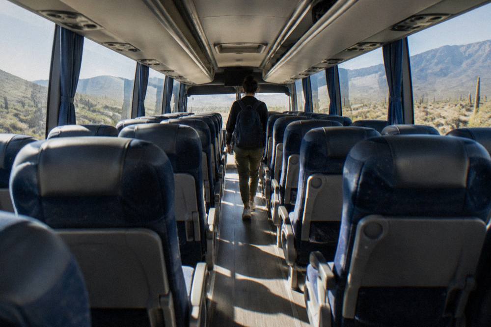 Interior of a modern long distance coach with reclining seats and large windows