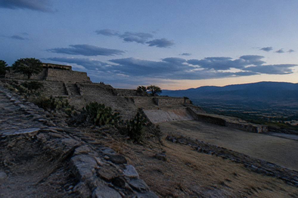 Ancient stone walls and terraces at the Yagul archaeological zone under a wide sky