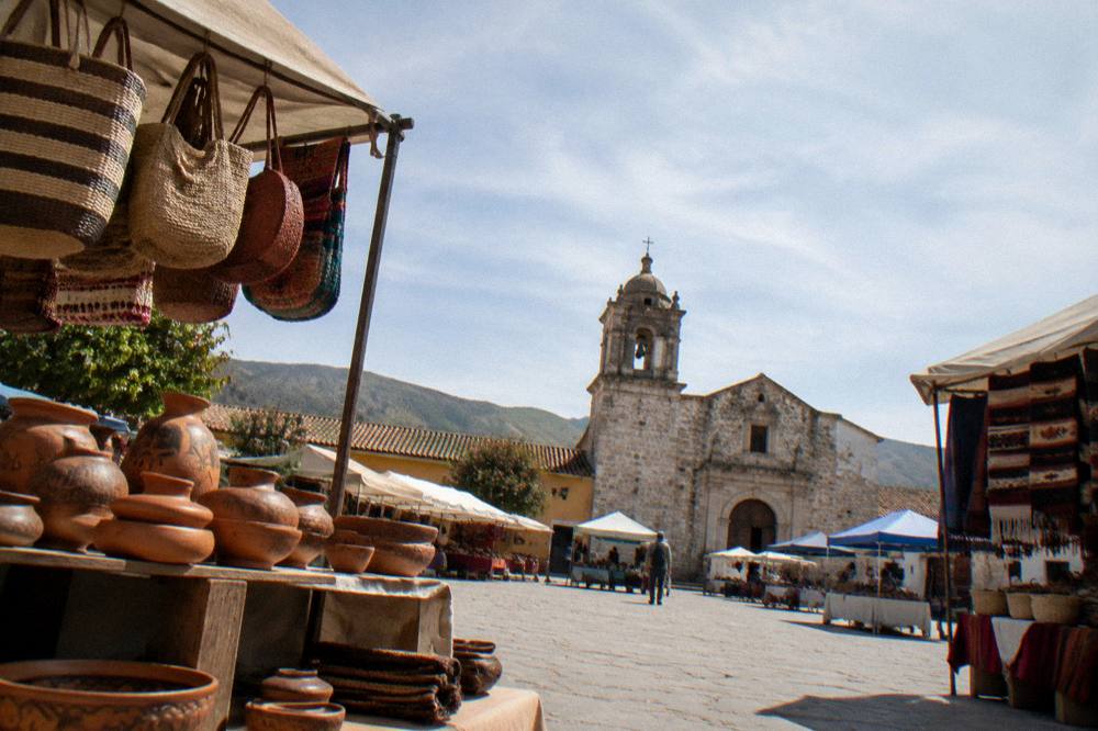 Pottery and woven goods displayed in a craft village workshop in the Oaxaca valleys