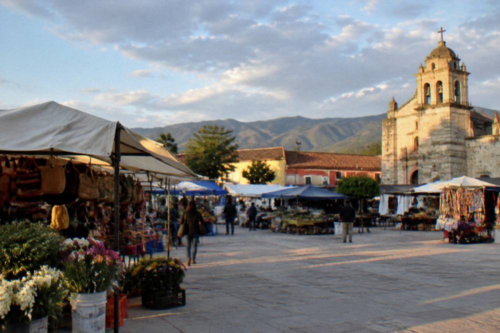 Evening light on the rooftops and church of a small town in the Valles Centrales of Oaxaca