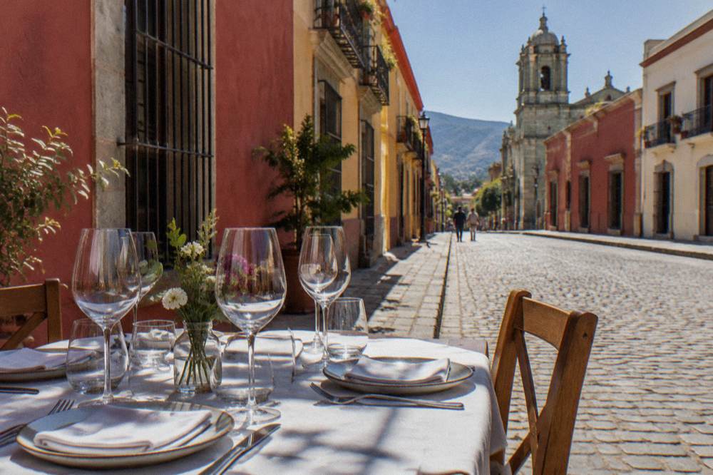 A formally set restaurant table with multiple wine glasses waiting for a tasting menu service