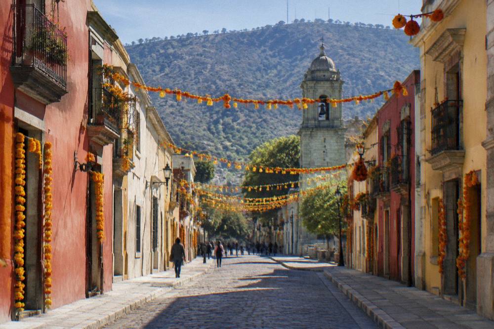 Festive garland and marigold decorations over a street in central Oaxaca