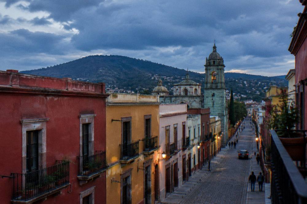 Rain clouds gathering over rooftops and church domes in Oaxaca City