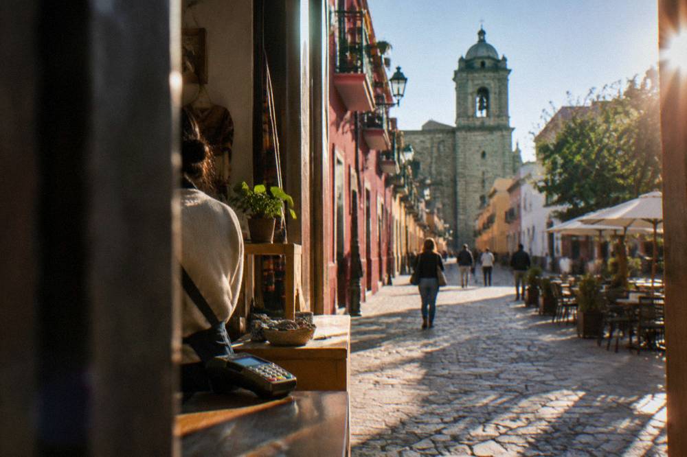 A shopfront on a pedestrian street in Oaxaca City with a small card terminal on the counter