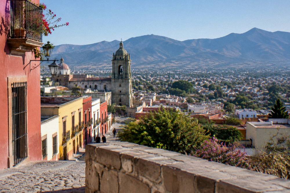 An overlook showing the spread of Oaxaca City across its valley at late afternoon