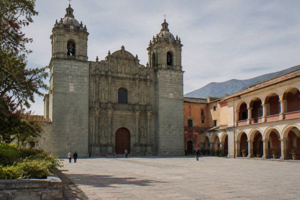 A courtyard of the former convent at Santo Domingo with arched walkways in Oaxaca City