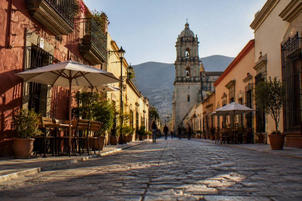 A pedestrian street in the historic centre of Oaxaca City lined with colonial buildings