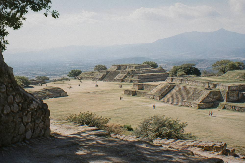 Ancient stone terraces of Monte Albán above the Oaxaca valley under wide sky
