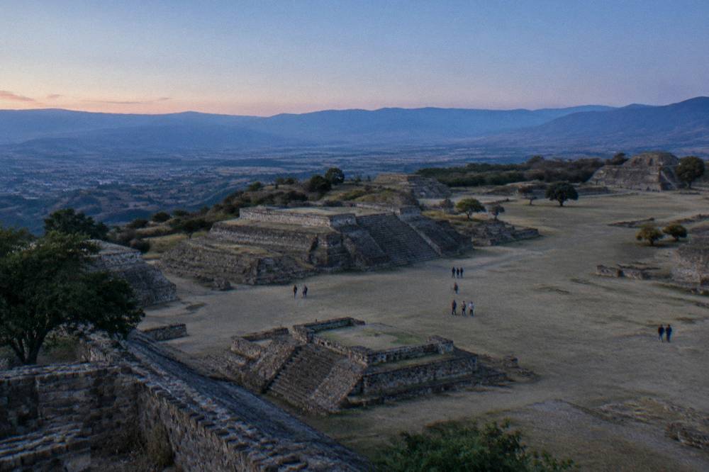 Stone terraces of the Monte Albán archaeological site under a clear sky