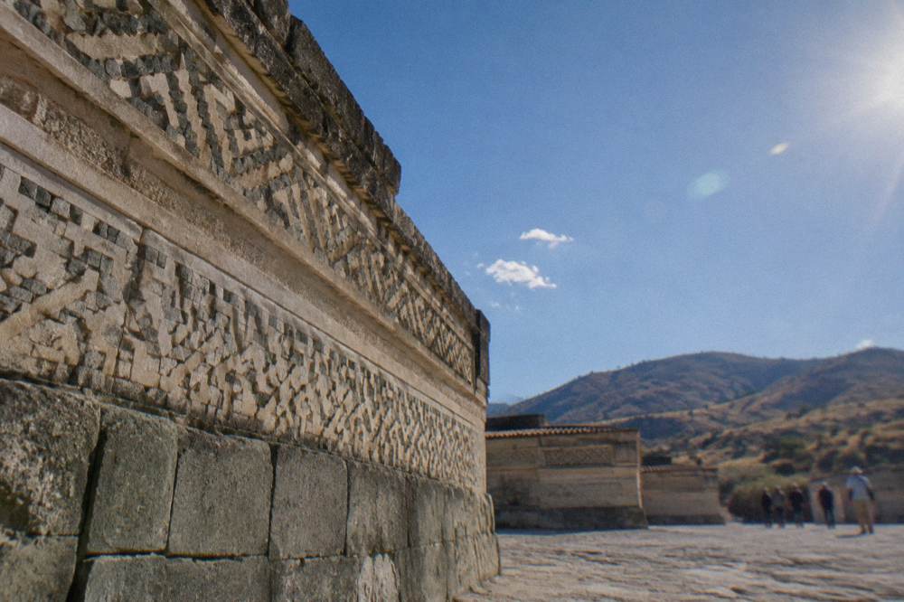 Stone mosaics and geometric grecas decoration on a wall at the Mitla archaeological zone