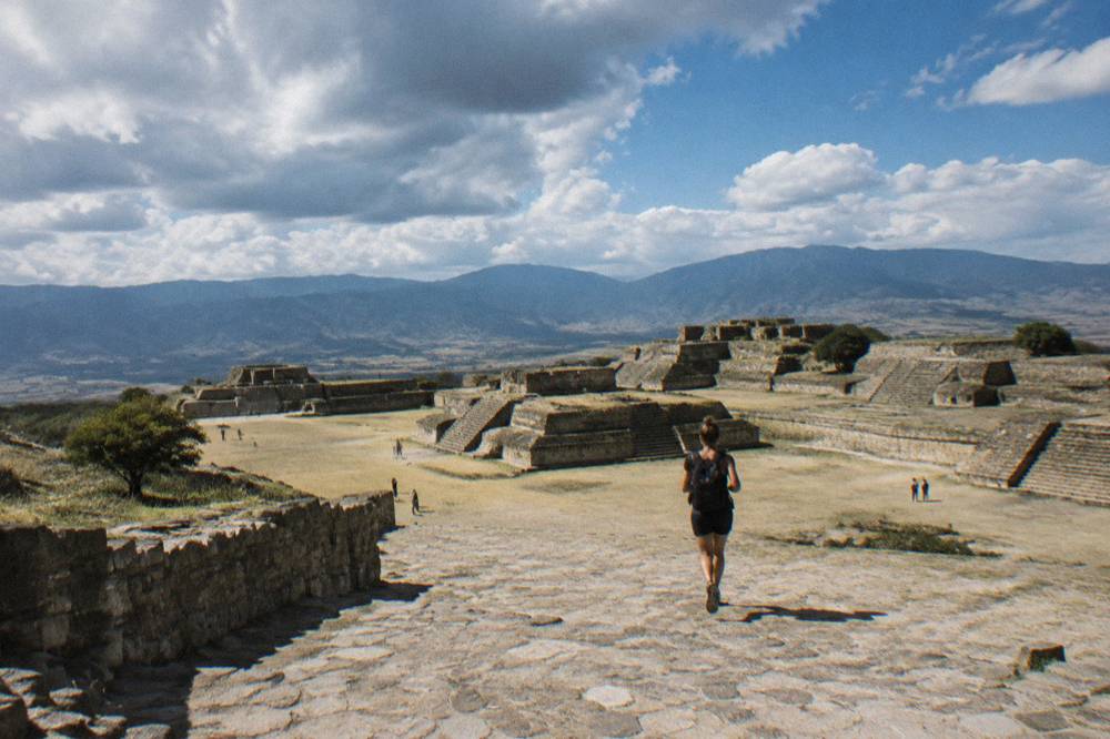 Stone terraces and stepped platforms of the Monte Albán archaeological zone under a wide sky