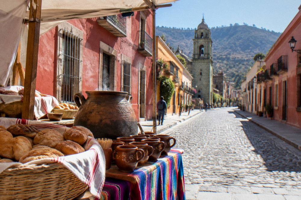 A food stand in a Oaxaca market serving hot chocolate with bread