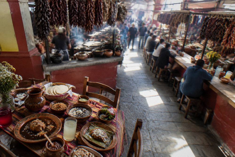 A table set with Oaxacan dishes and drinks ready for a meal