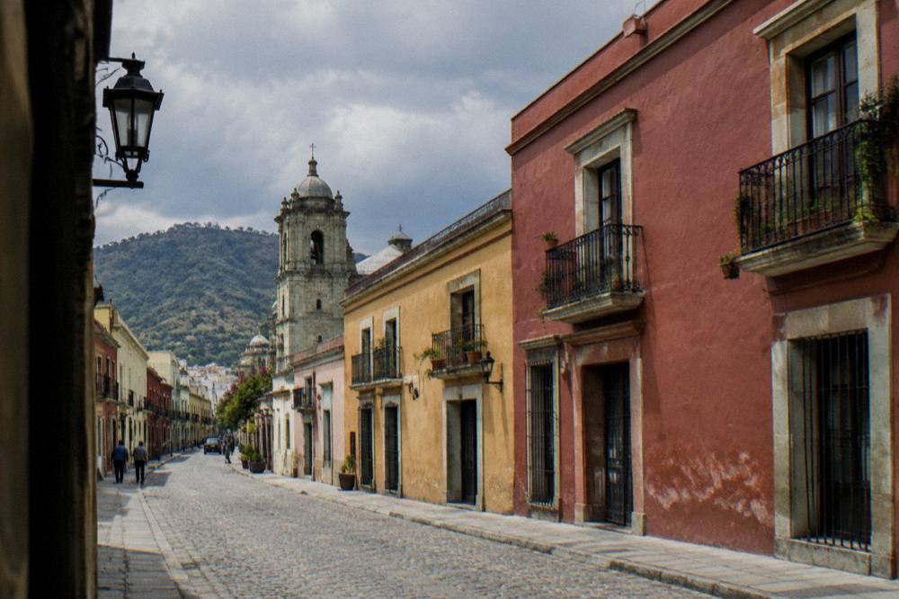 Rain clouds over the rooftops and churches of Oaxaca City