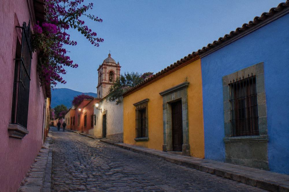 Colourful painted houses along a cobbled lane in the Jalatlaco neighbourhood of Oaxaca