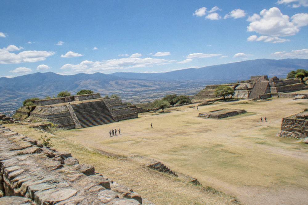The stone platforms of the Monte Albán archaeological zone under a wide sky