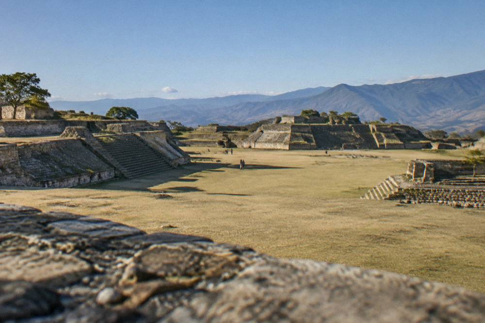 Stone platforms and terraces of the Monte Albán archaeological zone under a clear sky