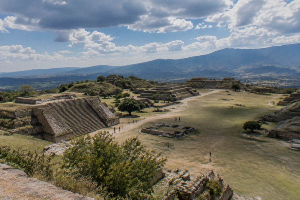 Stone terraces and platforms of the Monte Albán archaeological site under a wide sky